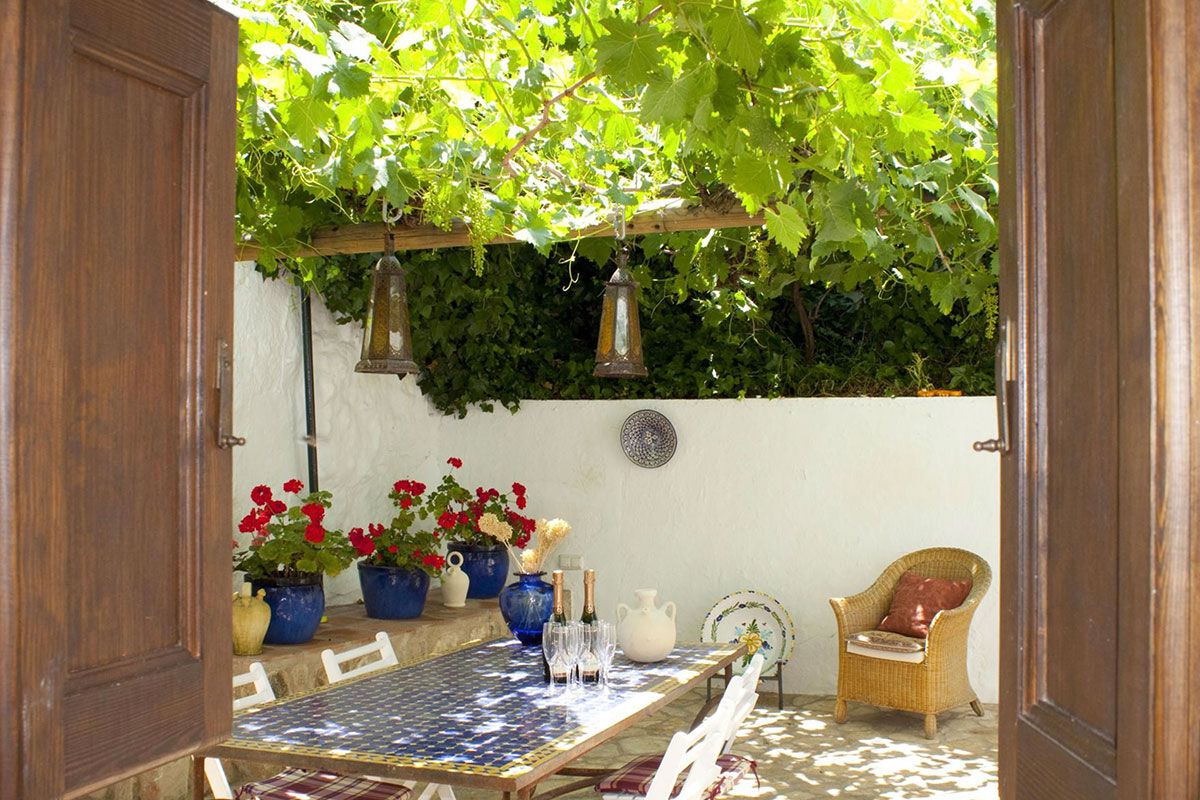 <b>El Molino del Conde, Malaga</b> - Located near the lovely Lake Iznajar, El Molino del Conde is a grand Andalucian mill house-turned holiday rental. Secluded by large gardens and surrounded by hills and olive groves, this charming white estate features a pool and multiple terraces where you can eat a leisurely dinner with family.