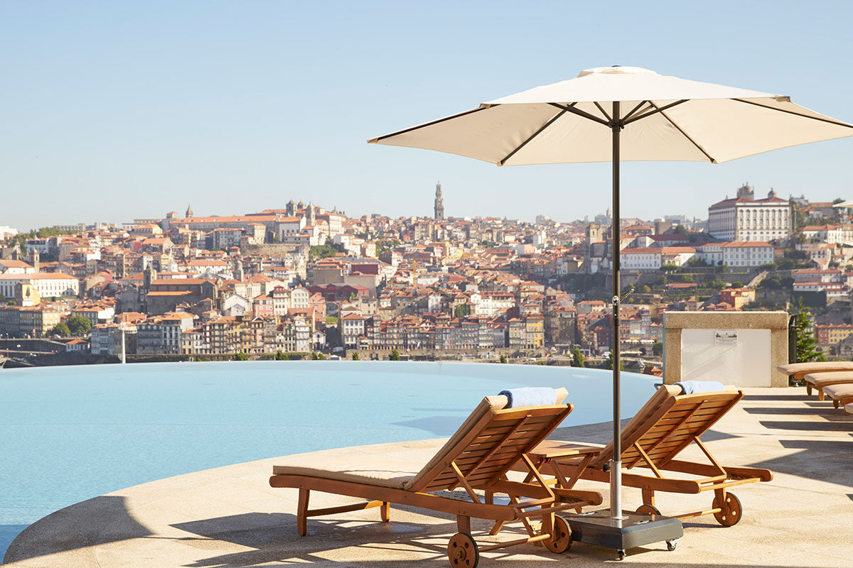 <b>The Yeatman Hotel</b> - Distinguished with a two Michelin-starred restaurant, this luxury wine hotel & spa is set in the beautiful historic district of Vila Nova de Gaia. Walk past the distinctive arches on the patio and head to the bar or wine cellar for a taste of the region.
