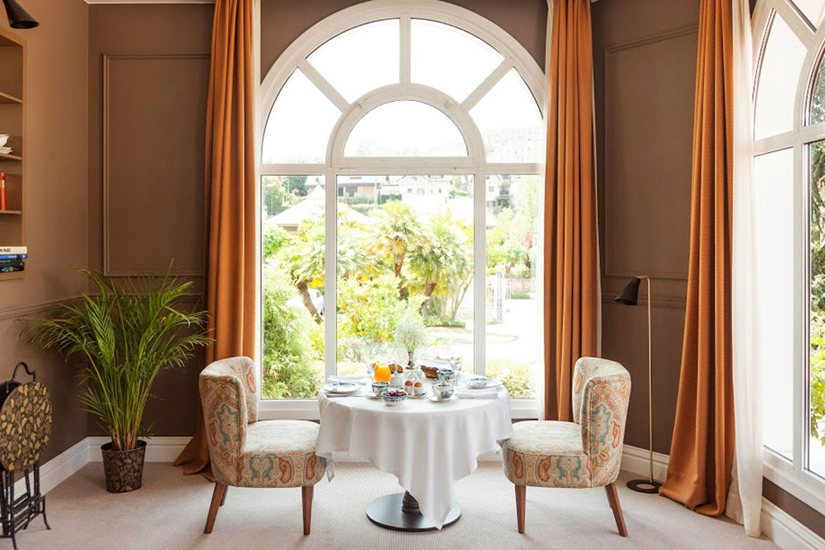 <b>Villa Soro, Donostia</b> - Close to Zurriola beach and San Sebastian Cathedral, Villa Soro occupies two buildings, one of which was built in 1898 and is a Historical Heritage Building of San Sebastian. In that building, the main hallway features a grand stairwell with a stained-glass window and marble floors; the rooms are refined with much natural light. The property boasts a wood-paneled bar and lounge.