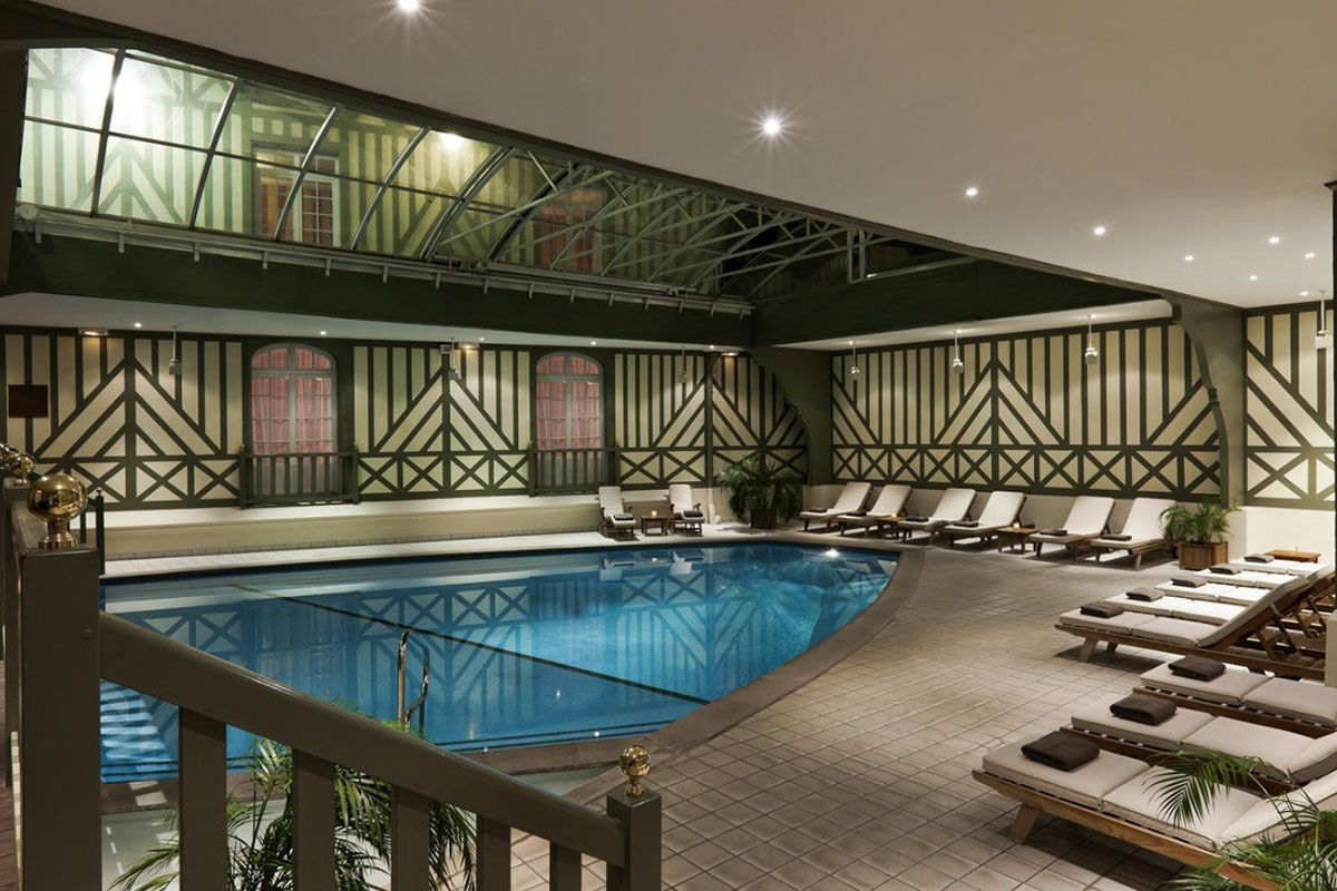 <b>Hotel Barrière Le Normandy</b> - With an air of Old-World elegance, this stately hotel is close to the Plage Deauville beach, Casino de Villers sur Mer and offers free loaner bikes for guests. Along with an indoor pool, tennis courts, and classically styled rooms, the Hotel Barriere Le Normandy also features a handsome bar with wood paneling and an elegant seafood restaurant with stained-glass windows.