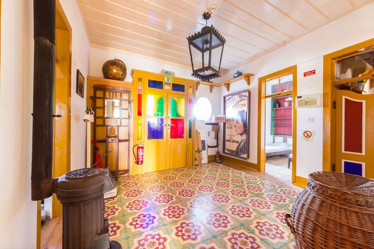 <b>Casa Paco D’Ilhas, Ericeira</b> - With heritage styling and a bright, colorful palette, the Casa Paco D’Ilhas immerses guests in a holistic leisure approach to life. With cabanas overgrown with tropical plants, a white stone pool, and décor with a rustic edge, this quaint hotel provides guests with an authentic experience - the perfect ocean getaway.