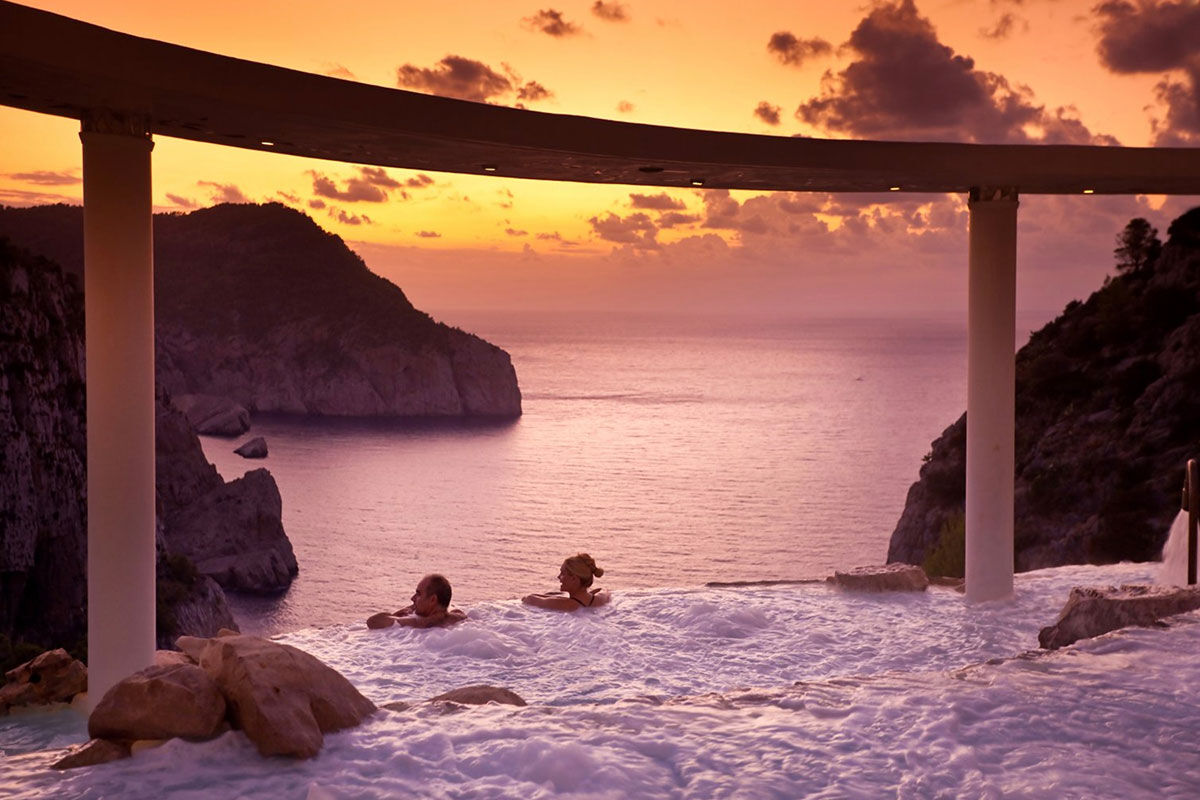 <b>Hacienda Na Xamena, Ibiza</b> - Removed from the clubbing areas of the island, Hacienda Na Xamena is an oasis to rejuvenate your body and overall well-being. The rooms are airy with incredible views, the restaurant and bar have lush plants throughout, and the combination of exposed wood and white-washed walls brings a feeling of freshness to your senses.