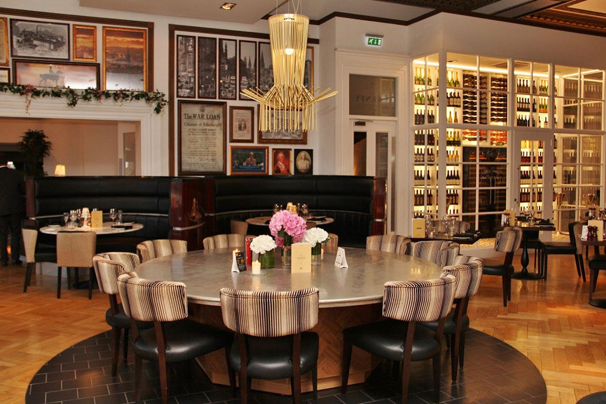 <b>Hotel Indigo Princes Street</b> - Close to museums and castles, this genteel hotel features dark wood, leather and aged photographs throughout, making you feel like you stepped into a moody upscale pub for a delicate cocktail. With tufted furnishings and modern touches, the Hotel Indigo Princes Street is the perfect match of traditional period pieces and contemporary details.