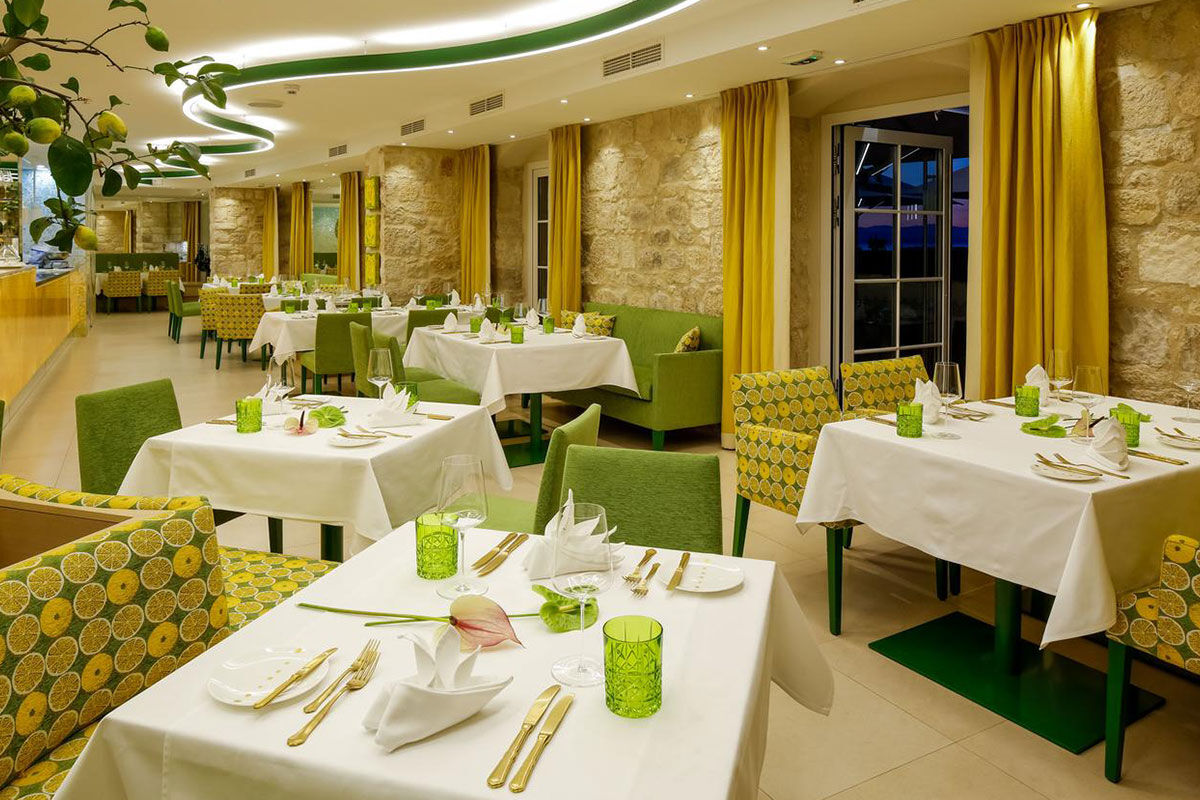 <b>Hotel Lemongarden, Brac</b> - Located right on the harbor of Sutivan, the Hotel Lemongarden is comprised of multiple 300-year-old stone houses with ample space to ensure a peaceful stay. This hidden gem is an adults-only property that features a private beach area, a pool nestled within a lush sculptured garden, and a dining room colored in yellow and lime - making nods to the hotel’s name.