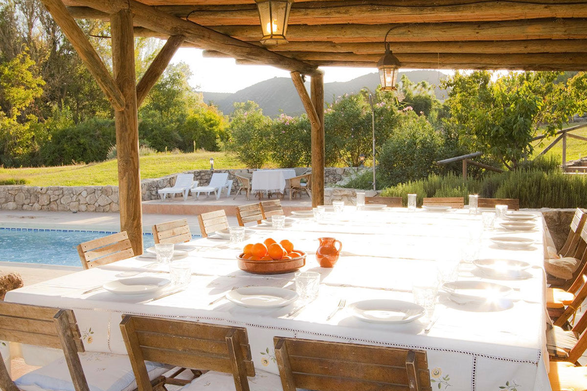 <b>El Molino del Conde, Malaga</b> - Located near the lovely Lake Iznajar, El Molino del Conde is a grand Andalucian mill house-turned holiday rental. Secluded by large gardens and surrounded by hills and olive groves, this charming white estate features a pool and multiple terraces where you can eat a leisurely dinner with family.