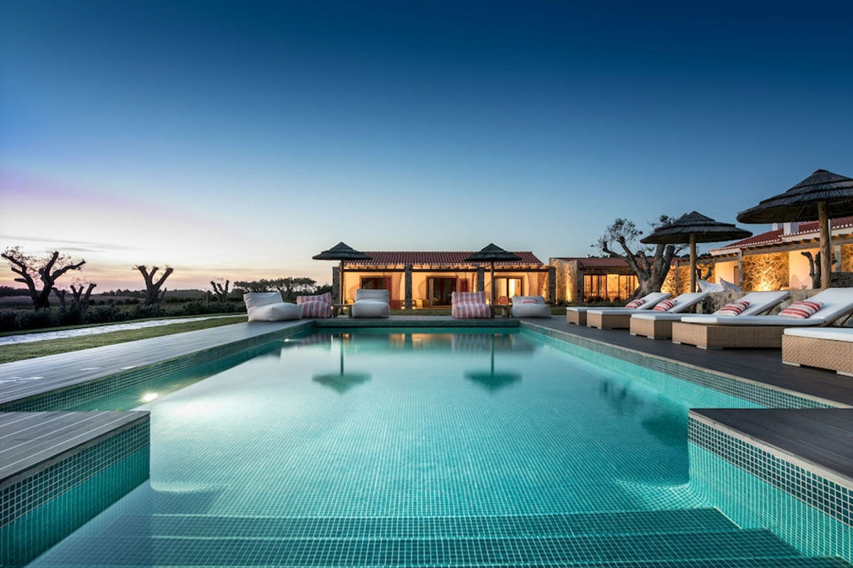 <b>Monte do Cardal, Odeceixe</b> - Cheery and bright, the Monte do Cardal is a boutique resort with pink hues and stripes pairing throughout. Lounge in the sun by the pool or admire the garden while sipping a refreshing drink before retreating to your county-chic room for a good night’s rest.