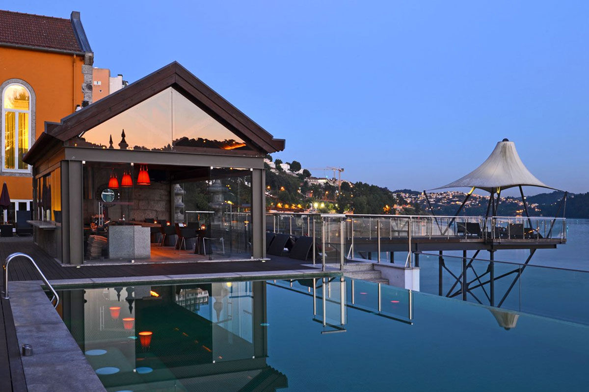 <b>Pestana Palácio do Freixo</b> - On the bank of the Douro River, guests wander through and around this 18th century palace to experience history and grandeur. Its lavish lounge, elegant rooms, and regional restaurant with frescos complete your refined holiday.