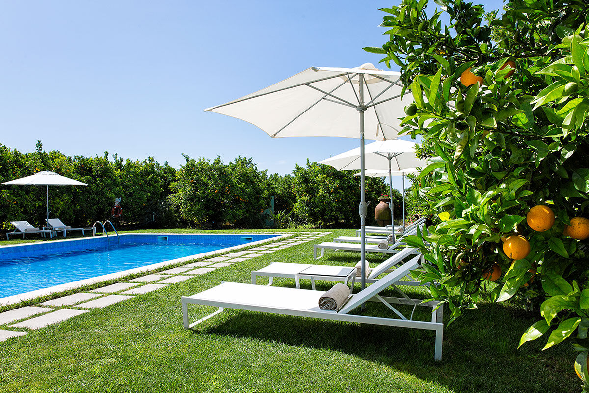 <b>Quinta dos Perfumes, Tavira</b> - Surrounded by an orange grove and full of other fruit trees, this perfume factory-turned-agritourism is quaint and romantic. The rooms are airy with a neutral palette, the pool is saltwater, and the lounge is cozy with a fireplace.