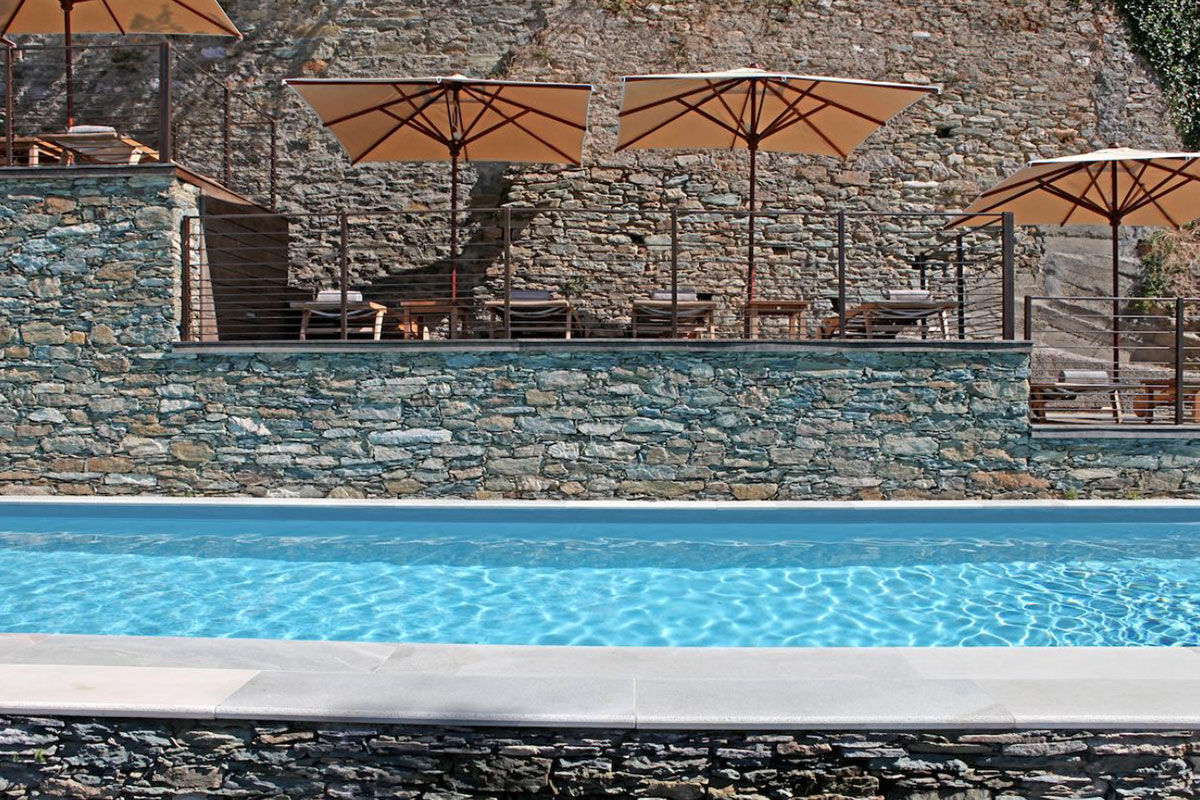 <b>U Palazzu Serenu Hotel, Oletta</b> - Featuring artworks and sculptures throughout the property, this 17th century Florentine-inspired villa is contemporary and sleek. With views of the mountains and sea from the pool, you’ll never want to leave its stone terrace.