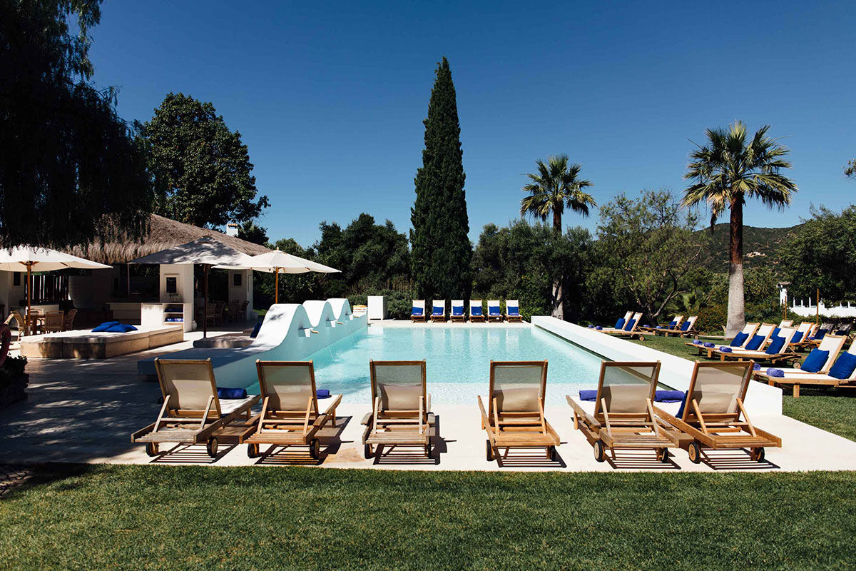 <b>Vila Monte Farm House, Moncarapacho</b> - A whole new level of luxe is introduced at this charming boho villa, inspired by traditional Algarve buildings. Surrounded by citrus trees, the Vila Monte Farm House offers a tranquil retreat for travelers who love lounging by the pool, admiring flowers in the garden and getting cozy by the fireplace.