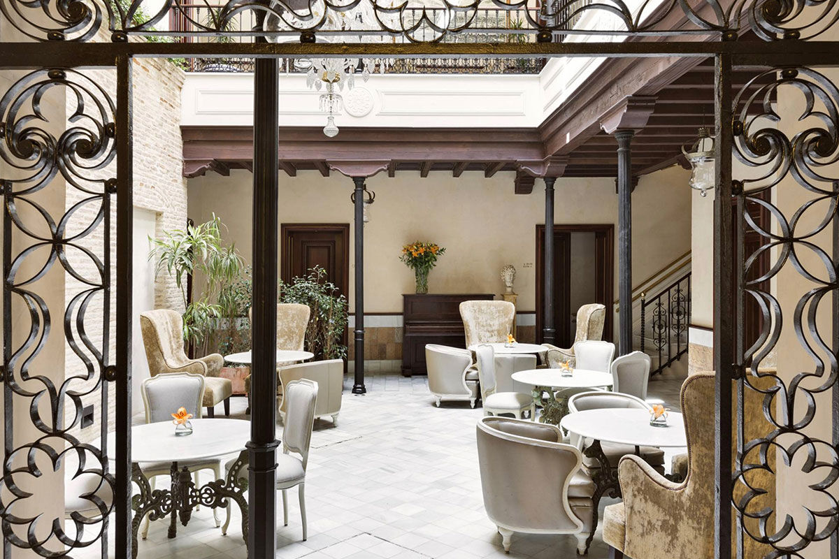 <b>Casa 1800 Sevilla</b> - Just a 2-minute walk from the Catedral de Sevilla, this 1864 mansion is ornate and sophisticated with a neutral toned palette. There’s a rooftop terrace with panoramic city views as well as a complimentary afternoon tea for guests to enjoy.