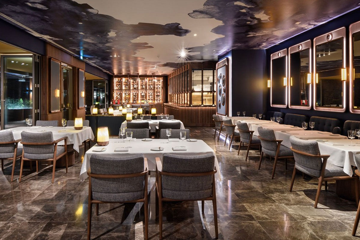 <b>Epic Sana Algarve, Albufeira</b> - Wander 7 minutes down to Praia da Falesia beach in the morning, play some tennis in the afternoon, cool off at one of 3 outdoor pools in the evening, and spend the night sipping cocktails while watching the live entertainment perform. This is a typical day at Epic Sana Algarve, where guests appreciate the ultra-modern exteriors and upscale interiors.