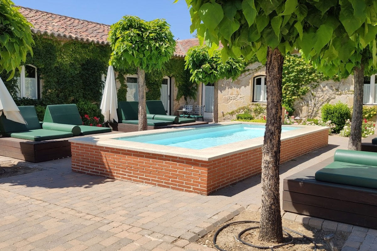 <b>Hacienda Zorita, Salamanca</b> - What once was an ancient Dominican monastery of the 14th century, Hacienda Zorita is a wine hotel and organic farm located on the River Tormes and is surrounded by countryside and vineyards. Taste the small batch wines, savor local cuisine, and admire the exposed wooden beams, stone walls, and almost-Tuscan finishes.