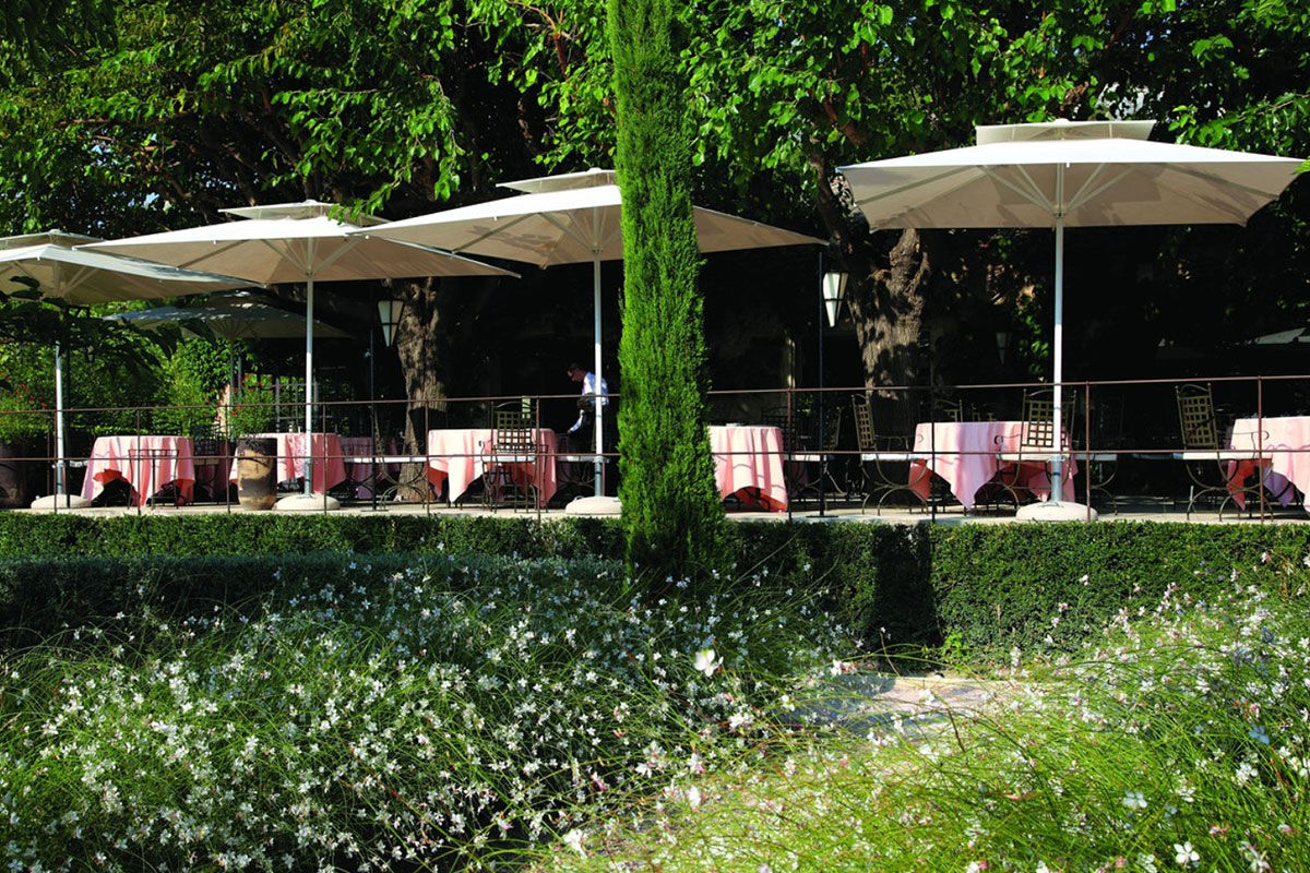 <b>Hotel Baumaniere, Les Baux de Provence</b> - With a 2-Michelin star restaurant, spa with hammam, tennis court, lounge-bar, pool and bike rental on site, the Baumaniere is full of activity. The rooms are modern, yet Provencal, the gardens and ponds are charming, and the boutique sells local products to savor.