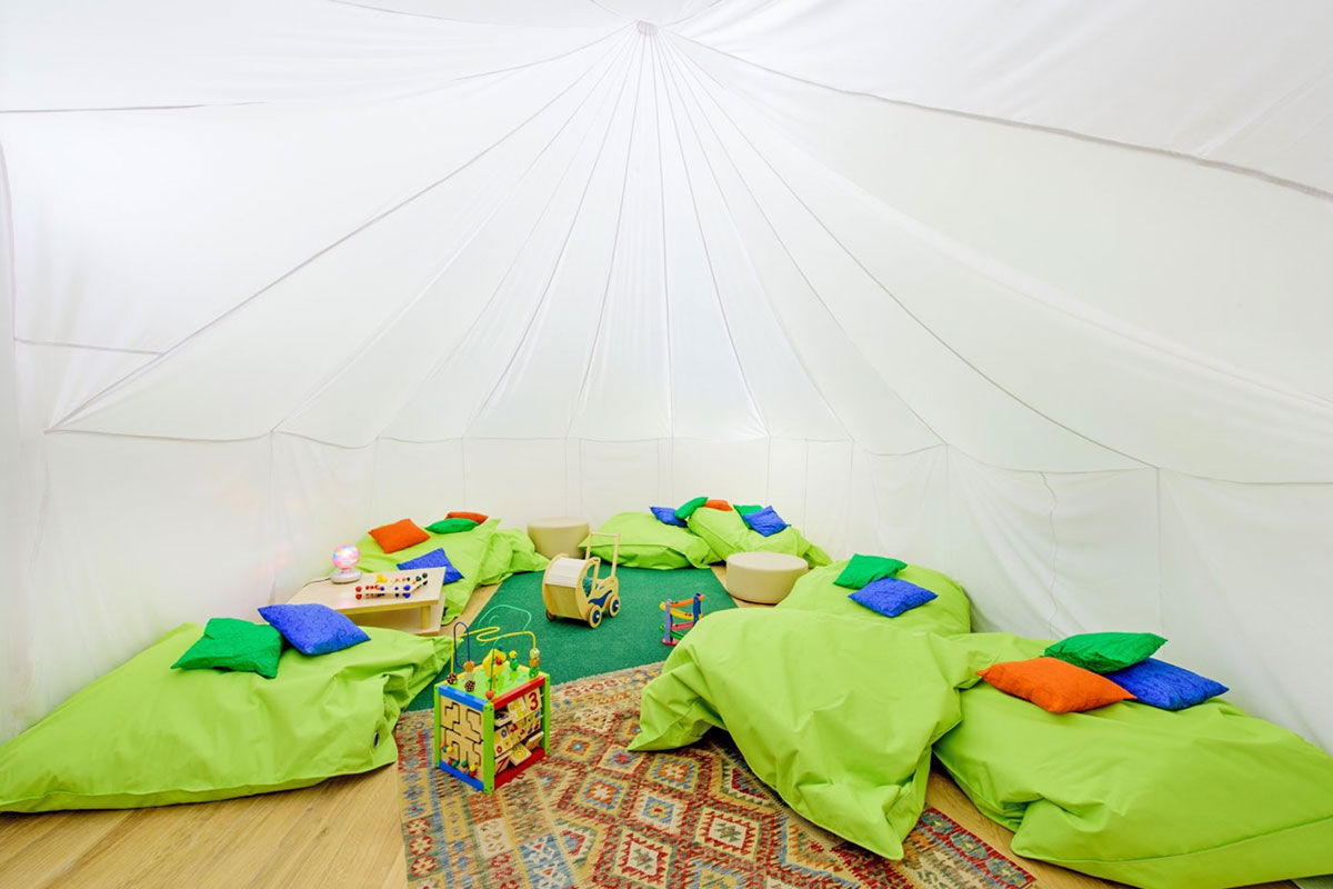 <b>Martinhal Lisbon Chiado Family Suites</b> - With bright colors, mid-century modern furniture and striking artwork, this kid-friendly hotel is fun for the whole family. The casual café has vaulted ceilings and a shiny red buggy on display, there are multiple kids’ areas (one of which is inside a tent!) and the Scandinavian design gives a sense of peace and innovation.