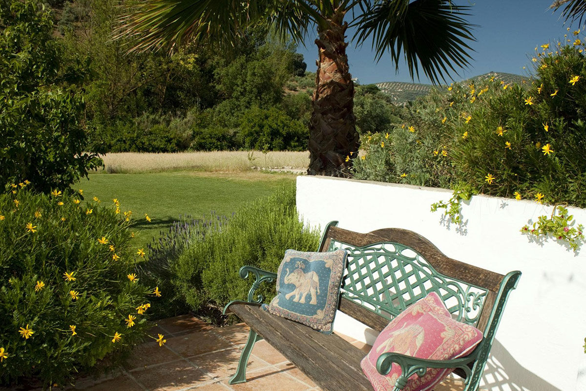 <b>El Molino del Conde, Malaga</b> - Located near the lovely Lake Iznajar, El Molino del Conde is a grand Andalucian mill house-turned holiday rental. Secluded by large gardens and surrounded by hills and olive groves, this charming white estate features a pool and multiple terraces where you can eat a leisurely dinner with family.