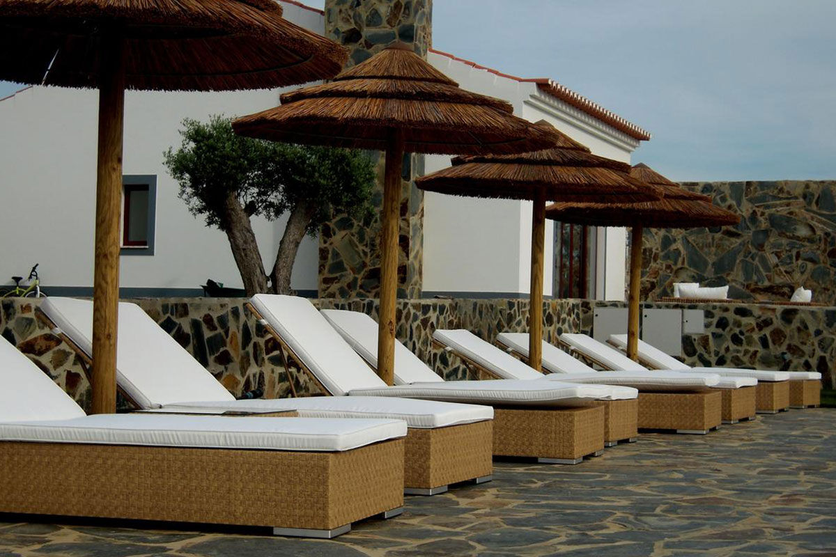 <b>Monte do Cardal, Odeceixe</b> - Cheery and bright, the Monte do Cardal is a boutique resort with pink hues and stripes pairing throughout. Lounge in the sun by the pool or admire the garden while sipping a refreshing drink before retreating to your county-chic room for a good night’s rest.