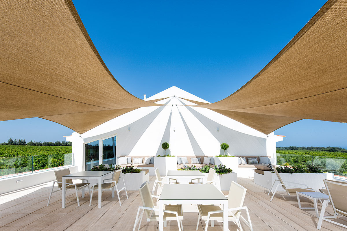 <b>Quinta dos Perfumes, Tavira</b> - Surrounded by an orange grove and full of other fruit trees, this perfume factory-turned-agritourism is quaint and romantic. The rooms are airy with a neutral palette, the pool is saltwater, and the lounge is cozy with a fireplace.