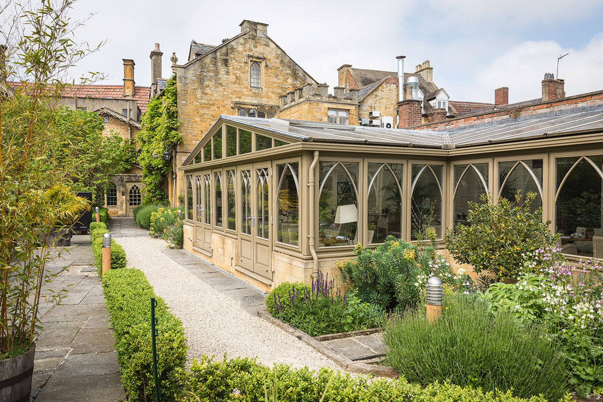 <b>The Manor House Hotel, Moreton-in-Marsh</b> - The Manor House Hotel and is a handsome 16th century retreat with stunning walled-in gardens featuring their famous mulberry tree. The stone architecture is enchanting, the rooms are styled in great taste, and several fireplaces make for a cozy environment. Finesse is here.