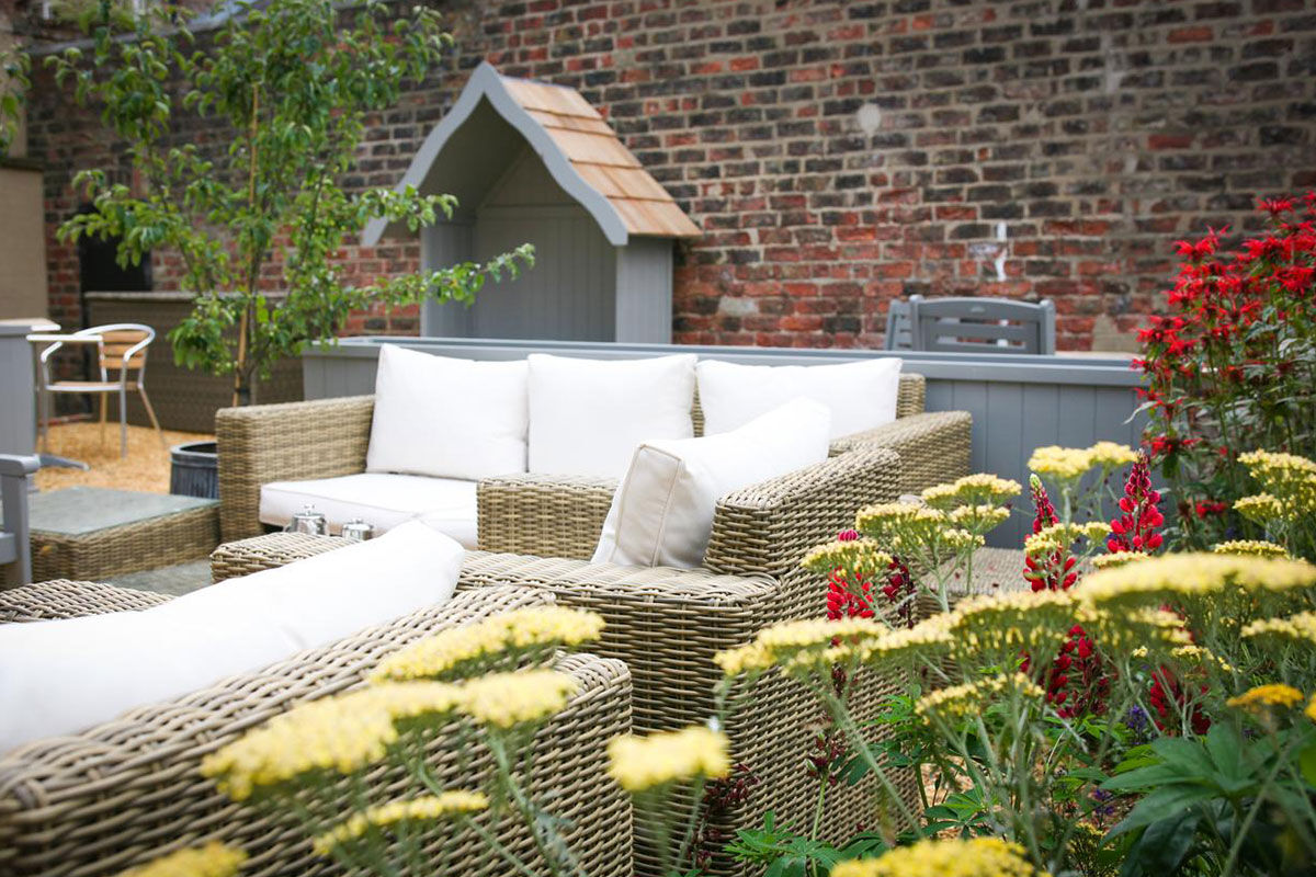 <b>The Parisi Hotel</b> - Only a 6-minute walk to The Shambles (a popular shopping street with timber-framed buildings), this converted rectory from the Victorian era is now a contemporary hotel overlooking the Church of St. Denys. With a library lounge and a garden with seating, this boutique hotel is cozy, bright and features colorful paintings throughout.