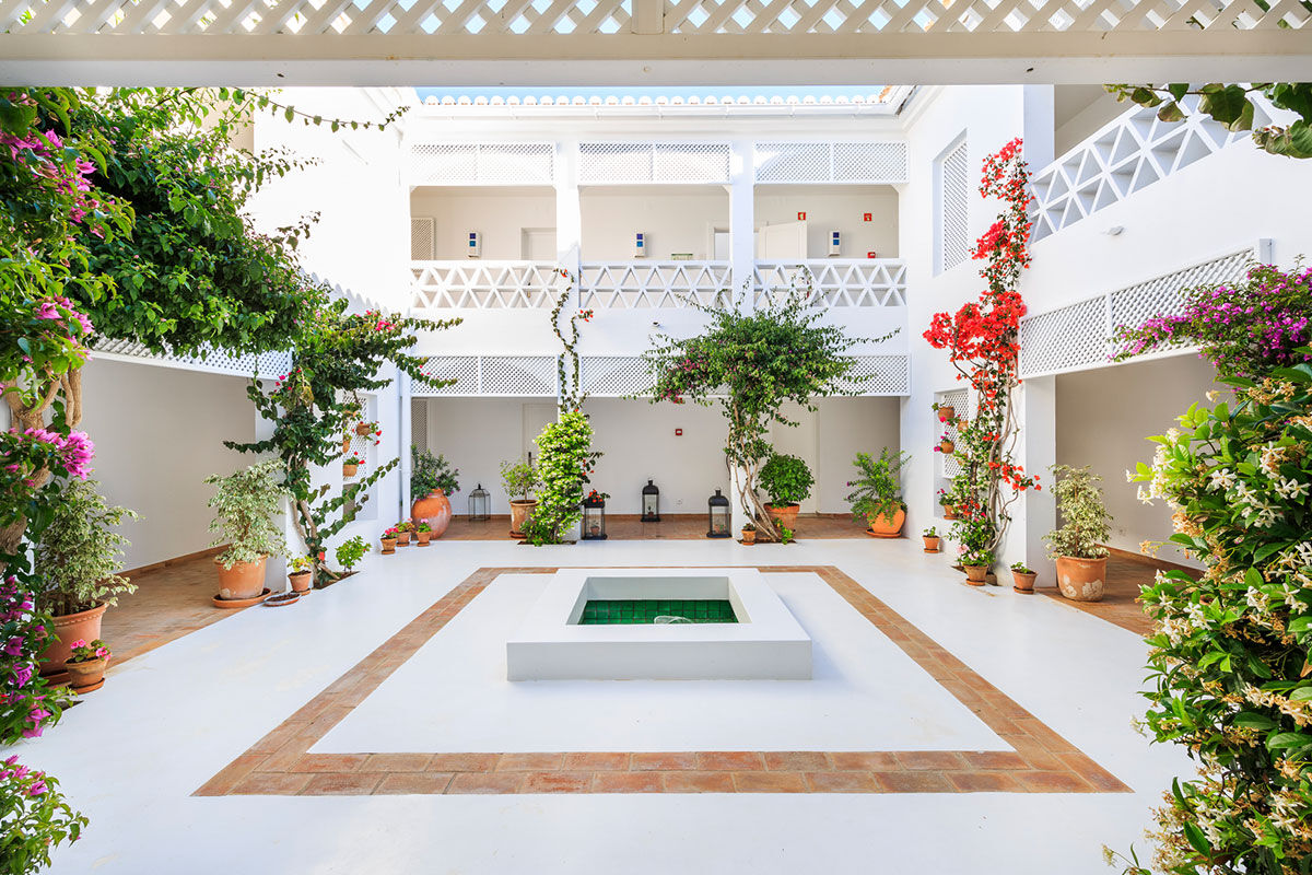 <b>Vila Monte Farm House, Moncarapacho</b> - A whole new level of luxe is introduced at this charming boho villa, inspired by traditional Algarve buildings. Surrounded by citrus trees, the Vila Monte Farm House offers a tranquil retreat for travelers who love lounging by the pool, admiring flowers in the garden and getting cozy by the fireplace.