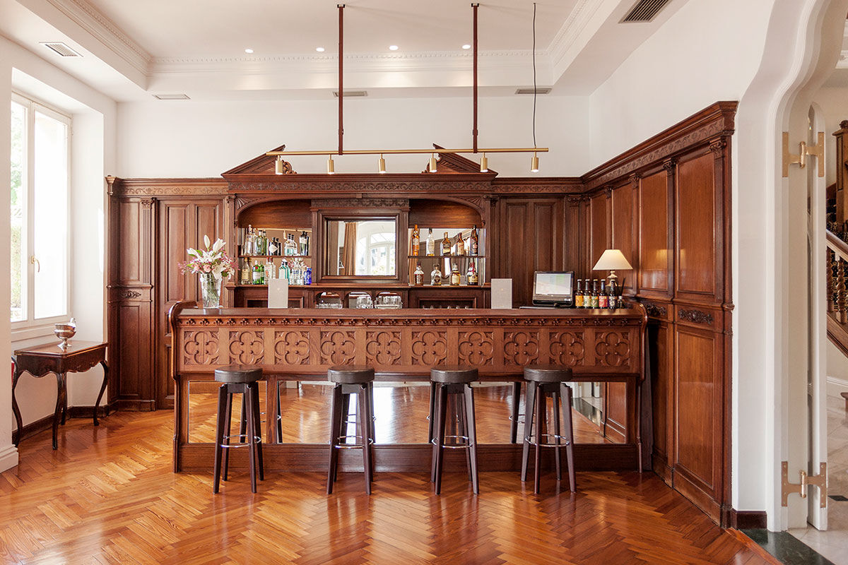 <b>Villa Soro, Donostia</b> - Close to Zurriola beach and San Sebastian Cathedral, Villa Soro occupies two buildings, one of which was built in 1898 and is a Historical Heritage Building of San Sebastian. In that building, the main hallway features a grand stairwell with a stained-glass window and marble floors; the rooms are refined with much natural light. The property boasts a wood-paneled bar and lounge.