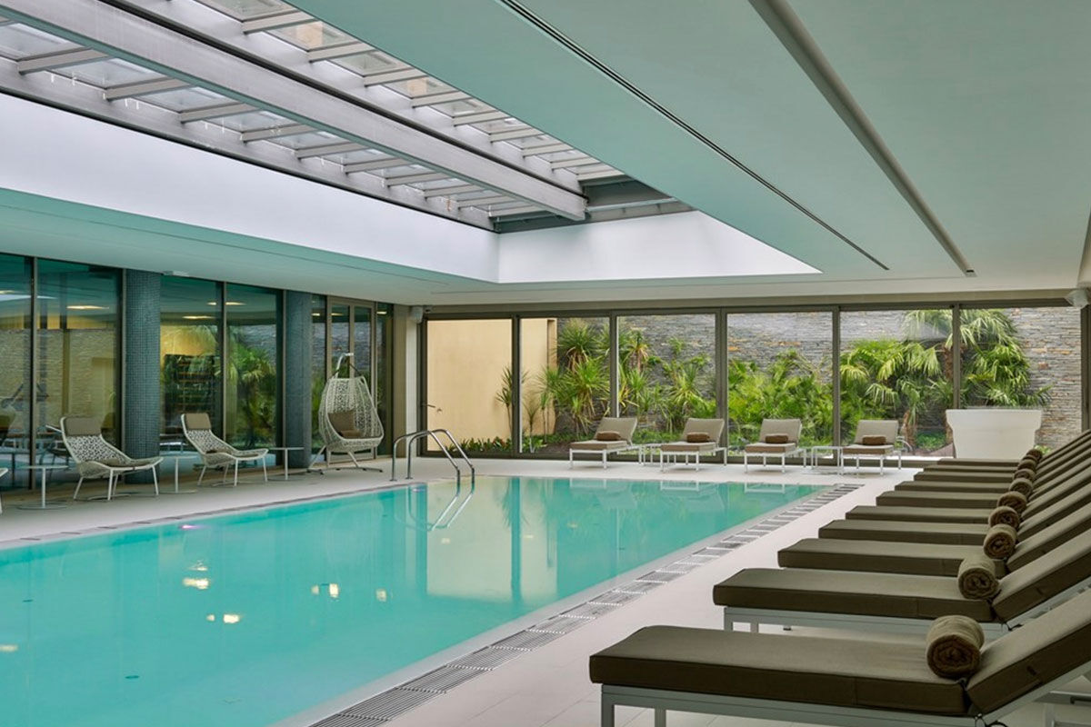 <b>Epic Sana Algarve, Albufeira</b> - Wander 7 minutes down to Praia da Falesia beach in the morning, play some tennis in the afternoon, cool off at one of 3 outdoor pools in the evening, and spend the night sipping cocktails while watching the live entertainment perform. This is a typical day at Epic Sana Algarve, where guests appreciate the ultra-modern exteriors and upscale interiors.