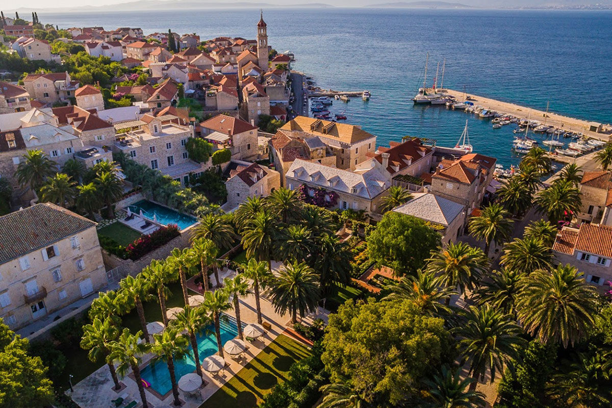 <b>Hotel Lemongarden, Brac</b> - Located right on the harbor of Sutivan, the Hotel Lemongarden is comprised of multiple 300-year-old stone houses with ample space to ensure a peaceful stay. This hidden gem is an adults-only property that features a private beach area, a pool nestled within a lush sculptured garden, and a dining room colored in yellow and lime - making nods to the hotel’s name.