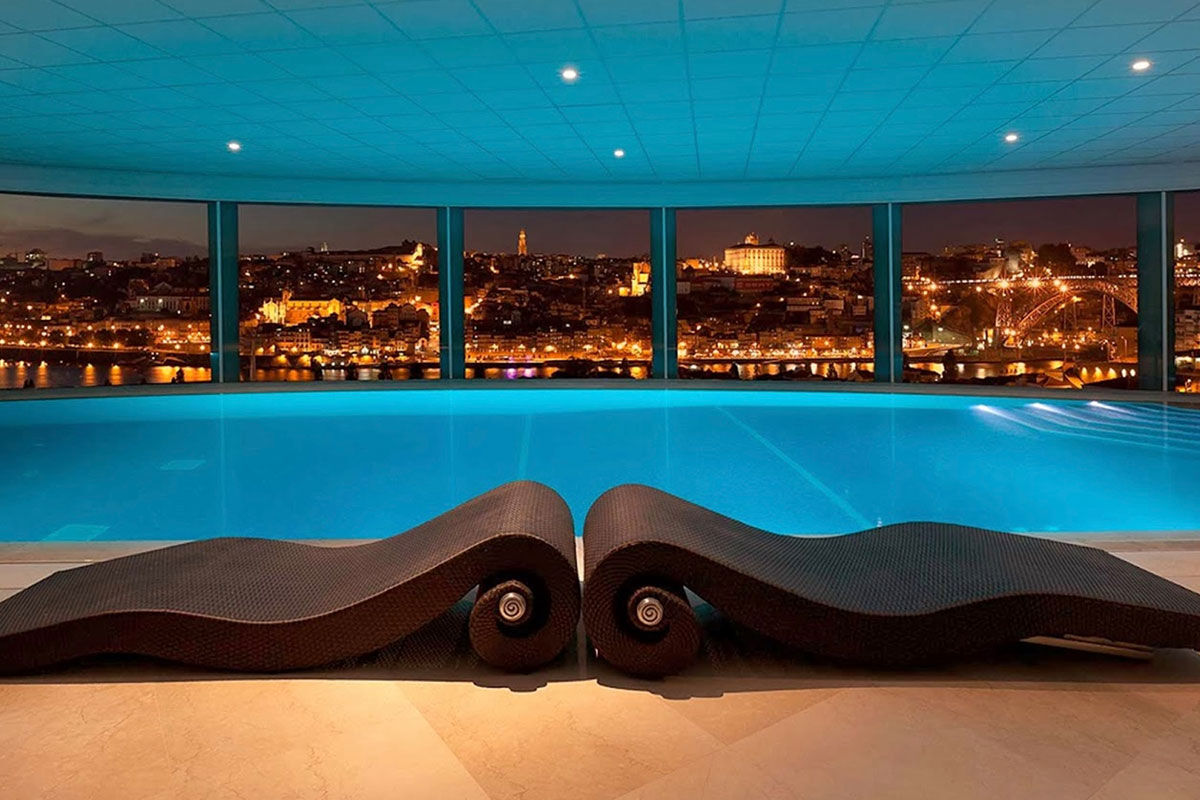 <b>The Yeatman Hotel</b> - Distinguished with a two Michelin-starred restaurant, this luxury wine hotel & spa is set in the beautiful historic district of Vila Nova de Gaia. Walk past the distinctive arches on the patio and head to the bar or wine cellar for a taste of the region.