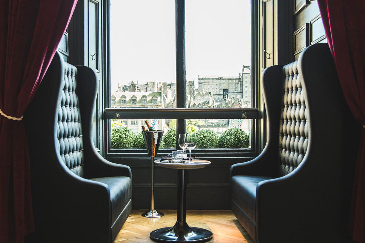 <b>Hotel Indigo Princes Street</b> - Close to museums and castles, this genteel hotel features dark wood, leather and aged photographs throughout, making you feel like you stepped into a moody upscale pub for a delicate cocktail. With tufted furnishings and modern touches, the Hotel Indigo Princes Street is the perfect match of traditional period pieces and contemporary details.