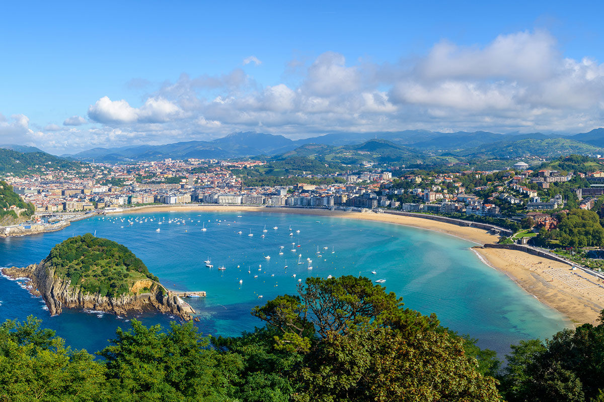 <b>Villa Soro, Donostia</b> - Close to Zurriola beach and San Sebastian Cathedral, Villa Soro occupies two buildings, one of which was built in 1898 and is a Historical Heritage Building of San Sebastian. In that building, the main hallway features a grand stairwell with a stained-glass window and marble floors; the rooms are refined with much natural light. The property boasts a wood-paneled bar and lounge.