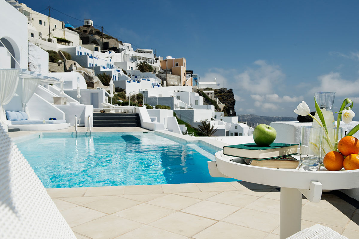 <b>Astra Suites, Imerovigli</b> - Set high on top of volcanic cliffs by the edge of the peaceful village Imerovigli, this all-suite hotel is contemporary and welcoming. Offering an infinity pool, romantic dining experiences and a spa area with a massage room, this picturesque complex helps guests enjoy life’s simple pleasures.