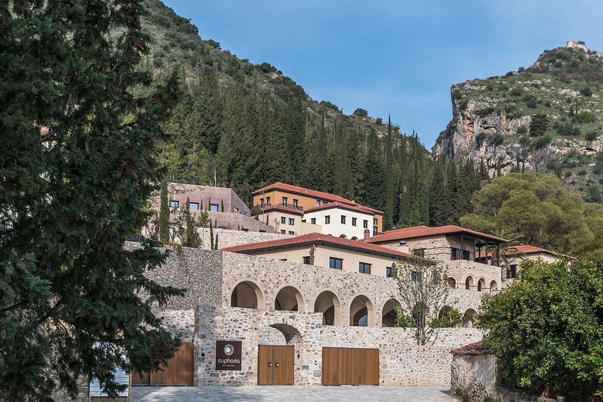 <b>Euphoria Retreat, Mystras</b> - Nestled in the hills of the Peloponnese peninsula, the Euphoria Retreat is a holistic wellbeing spa featuring an infinity pool, sphere pool and views of the mythical mountains. With earthy colors and a modern design scheme, this retreat center finds balance with nature and ancient medicine.