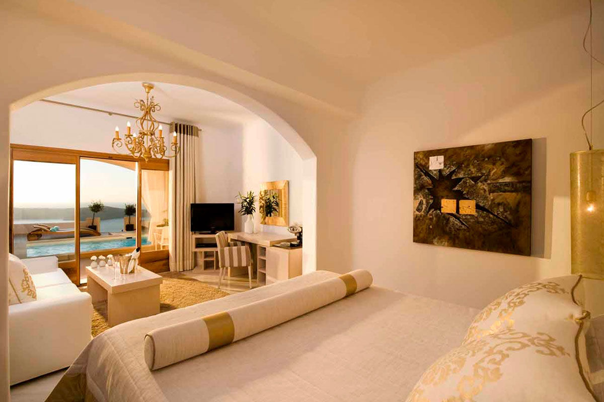 <b>Gold Suites, Imerovigli</b> - Located on the cliffside overlooking the Santorini Caldera, the Gold Suites offer spacious suites with a little glam. The infinity pool, poolside bar and open-air restaurant all face the Aegean Sea — and yet, you certainly will never tire of these views.