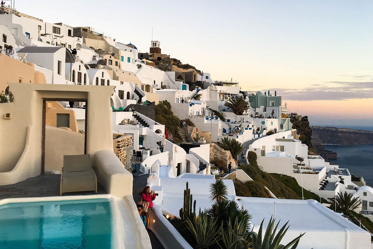 <b>Kapari Natural Resort, Imerovigli</b> - Housed in a 300-year-old Cycladic building, Kapari is an upscale hotel with minimalist décor and caldera views. Only a 30-minute scenic stroll to the hustle and bustle of Thira, Kapari is a tranquil retreat with a rooftop pool and fine dining restaurant/bar.