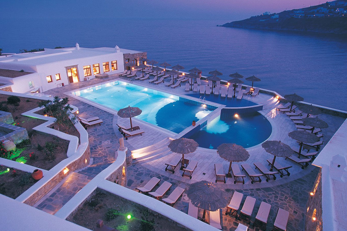 <b>Petasos Resort & Spa, Platis Yialos</b> - Sitting on a private peninsula and overlooking the Aegean Sea, the newly renovated Petasos Resort & Spa is Mediterranean luxury at its finest. With airy rooms, VIP restaurant, spa and a pool with views of the yachts in the Bay of Psarou, guests can enjoy privacy and peaceful tranquility.