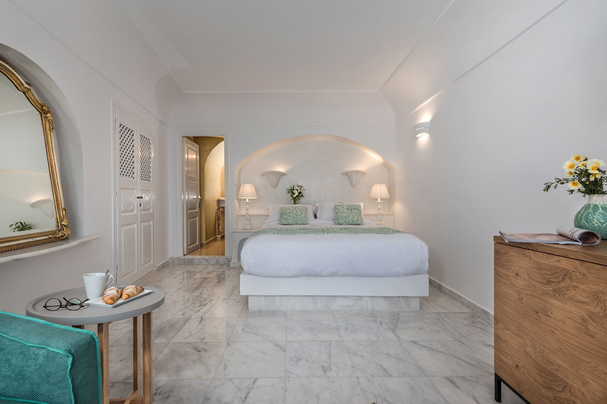 <b>Anteliz, Fira</b> - Airy and elegant with the essence of Theran design, the Anteliz Suites are perched on a hilltop overlooking the Aegean Sea. Close to the town of Fira, this boutique hotel offers panoramic views from the terrace where you can drift in the pool or relax in the hydro-massage hot tub.