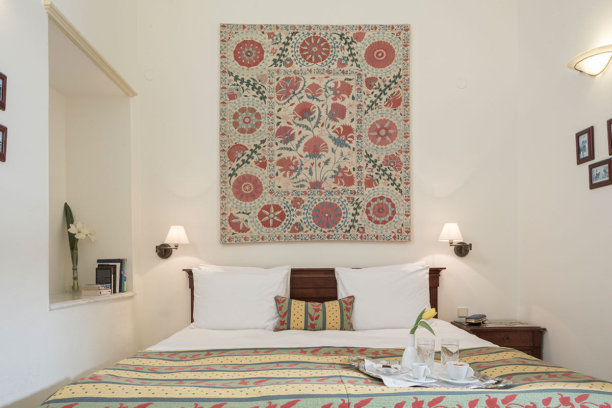 <b>Casa Delfino, Chania</b> - Housed within a 17th century Venetian mansion, this family-run boutique hotel has charm, class and a stunning courtyard with pebbled mosaics. Guests can enjoy a serene spa, rooftop garden or 7-minute walk to the Old Venetian Harbor.
