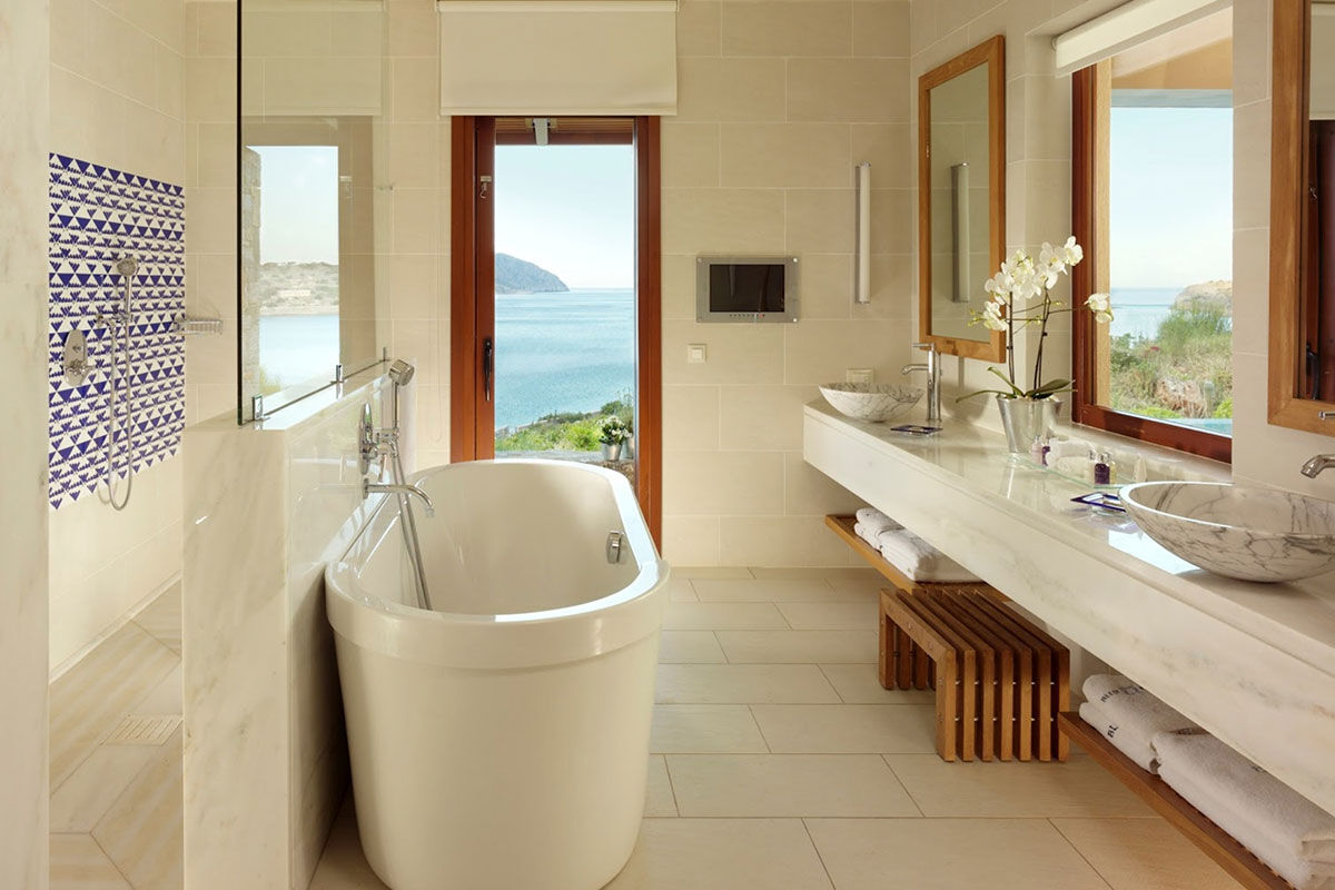 <b>Blue Palace, Elounda</b> - Tucked away on the Gulf of Elounda, the Blue Palace welcomes guests with refined, contemporary bungalows and breathtaking architecture. A real modern luxury experience, this resort features five restaurants, three bars, a spa, gym, and private beach.