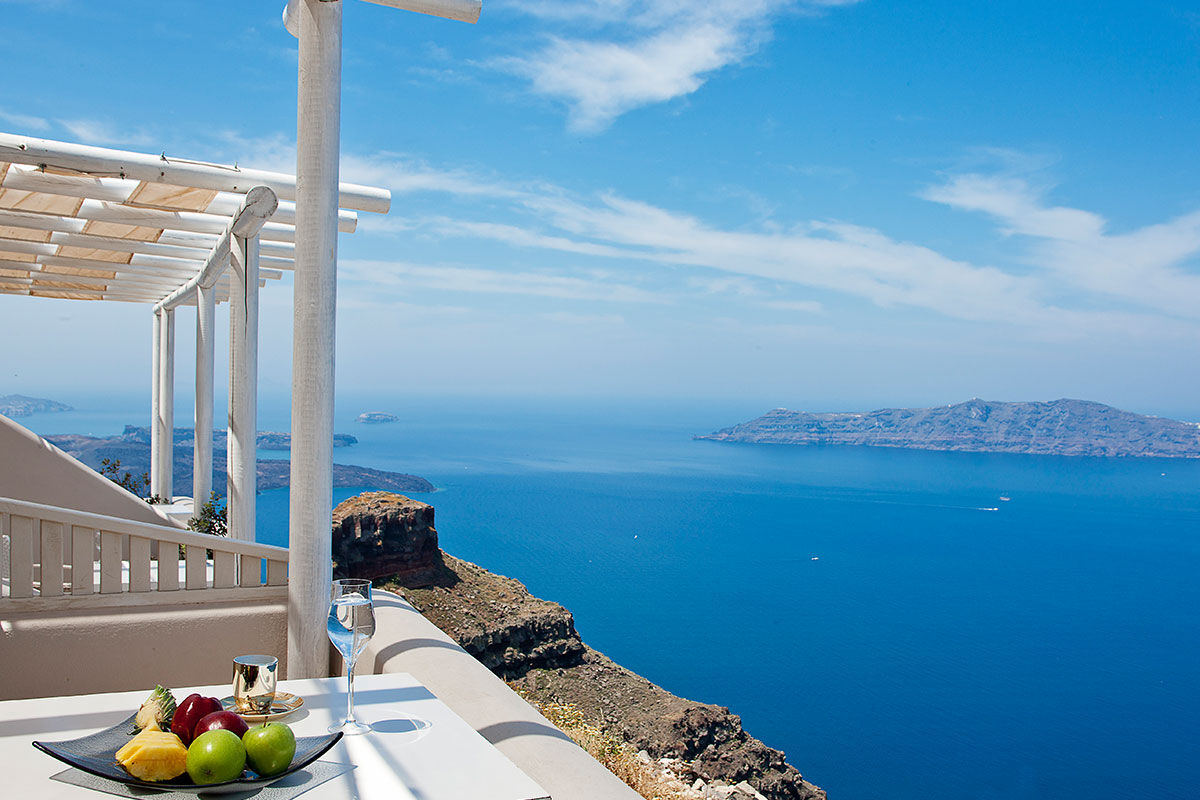<b>Gold Suites, Imerovigli</b> - Located on the cliffside overlooking the Santorini Caldera, the Gold Suites offer spacious suites with a little glam. The infinity pool, poolside bar and open-air restaurant all face the Aegean Sea — and yet, you certainly will never tire of these views.
