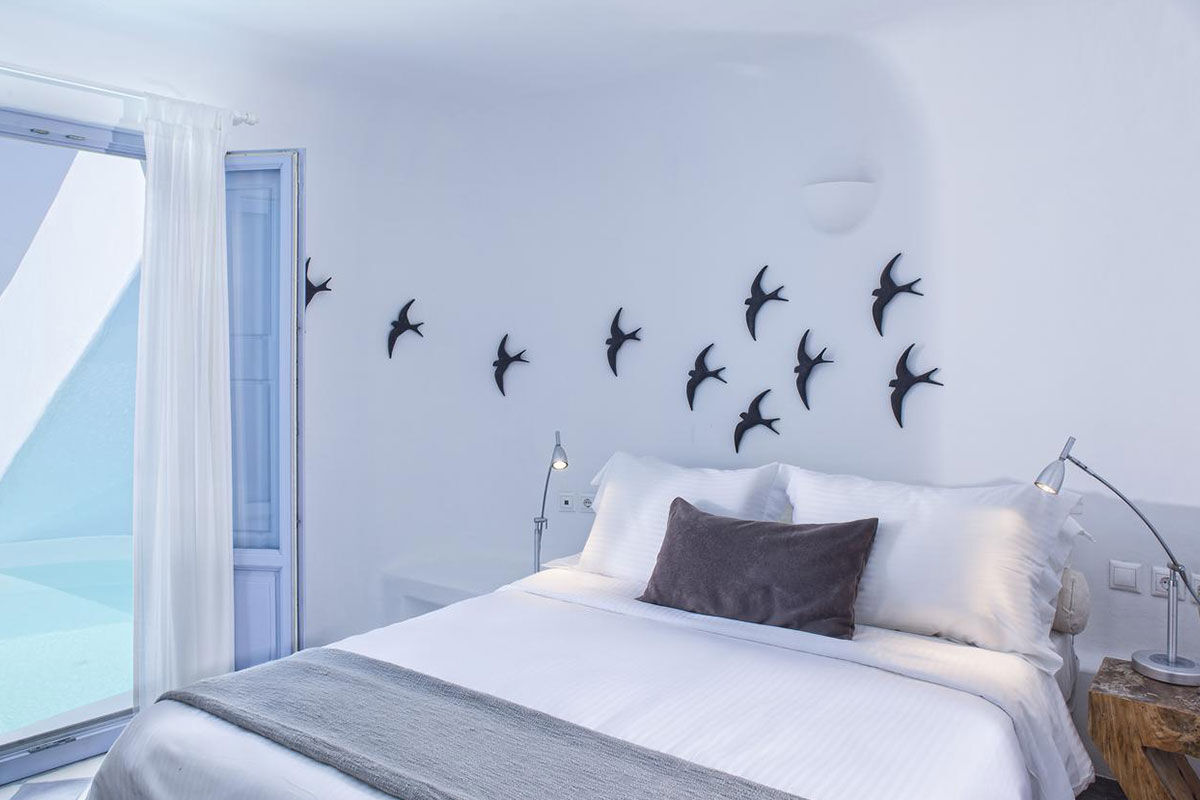 <b>Ikastikies Suites, Firostefani</b> - Set in the picturesque village of Firostefani, and just a short walk from the lively town of Thira, these 4 suites are housed in classic Cycladic-style buildings facing Santorini’s iconic caldera. The Ikastikies suites are bright and charming, the terrace has a pool, and the service goes above and beyond.