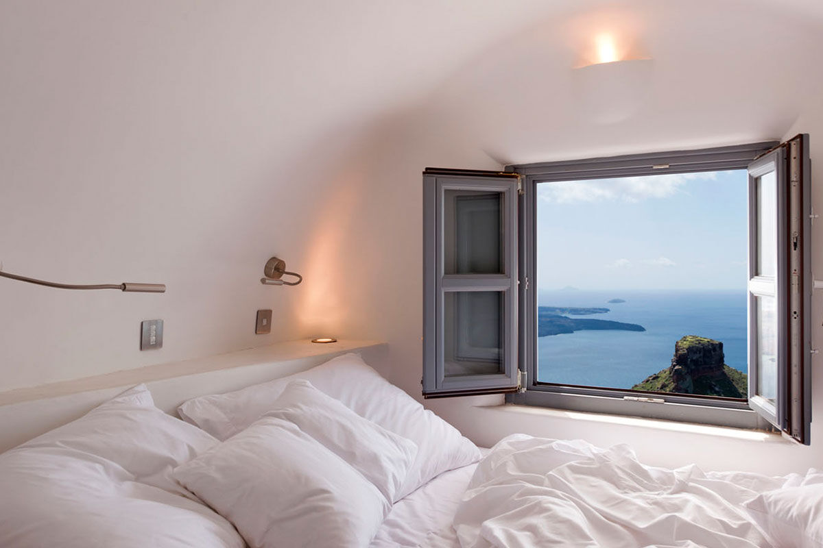 <b>Kapari Natural Resort, Imerovigli</b> - Housed in a 300-year-old Cycladic building, Kapari is an upscale hotel with minimalist décor and caldera views. Only a 30-minute scenic stroll to the hustle and bustle of Thira, Kapari is a tranquil retreat with a rooftop pool and fine dining restaurant/bar.