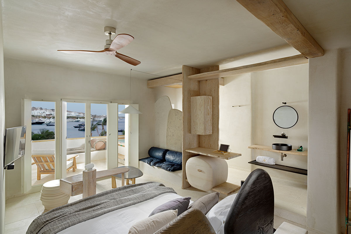 <b>Kensho, Psarou</b> - Nestled on Psarou Beach, Kensho is a clean, minimalist hotel with aged wood and stone trimmings. Rooms are contemporary and spacious, and guests can mingle at the poolside bar and restaurant with views of the crystal blue sea.