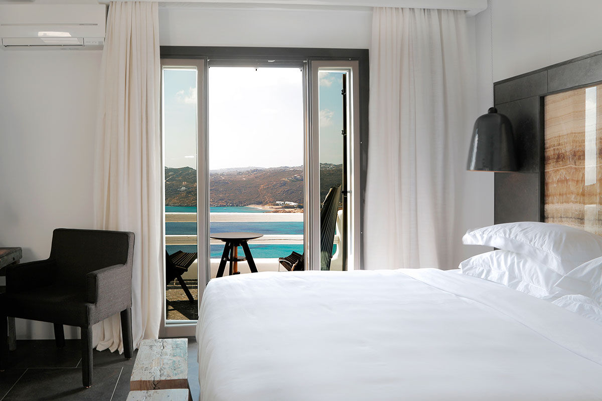 <b>Myconian Avaton, Elia</b> - Newly built in 2014, the Myconian Avaton resort juxtaposes traditional whitewashed exteriors with modern luxe interiors. Set on a private section of Elia Beach, this Cycladic architectural feat has a timeless authenticity that is only enhanced by its infinity pools, fine dining and contemporary furnishings.