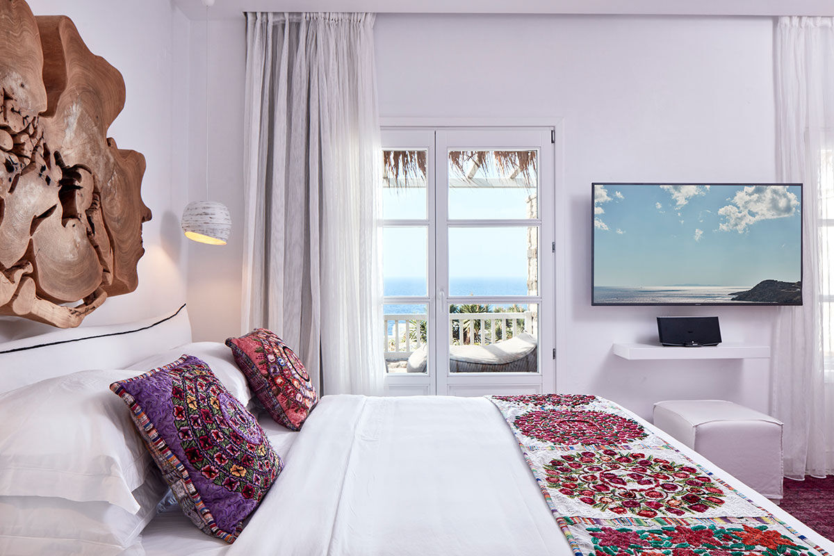 <b>Myconian Villa Collection, Elia</b> - Overlooking Elia Beach from its hillside perch, the Myconian Villa Collection offers luxurious rooms in a minimal Cycladic style with views of the Aegean Sea. Polished and contemporary, this hotel features an infinity pool, poolside bar and a fine dining restaurant right on the sundeck.