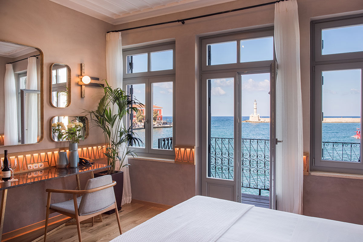 <b>Scala de Faro, Chania</b> - Located right on the Venetian harbor of Chania, this luxury boutique hotel has a sleek, contemporary style, with brass notes and warm coloring. Right in the middle of Old Town, guests have the cobblestone shopping street right outside their door.