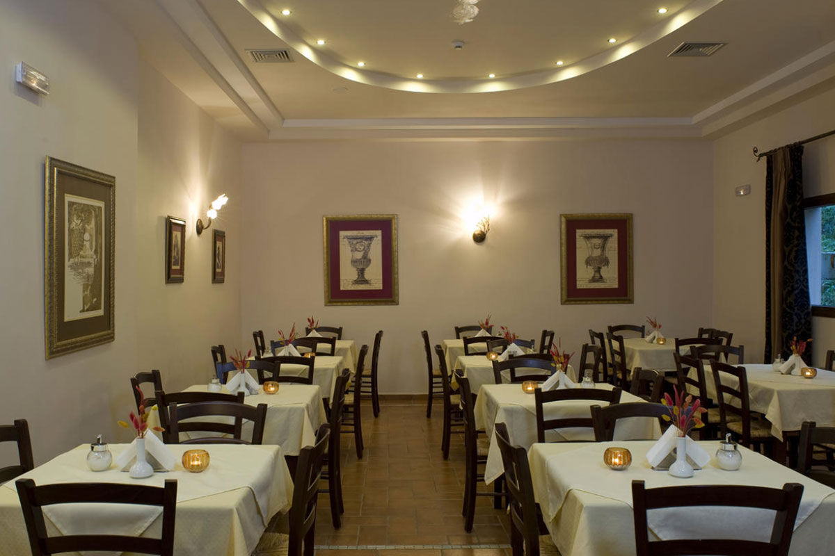 <b>Dellas Boutique Hotel, Kastraki</b> - With views of Meteora’s rocky landforms, this down to earth hotel features dark wood furnishings and stonework, bringing a natural feel to your stay. Meteora is classed as a World Heritage Site and the nearby monasteries are built on 14th century sandstone rock pillars — you won’t want to miss these natural beauties.