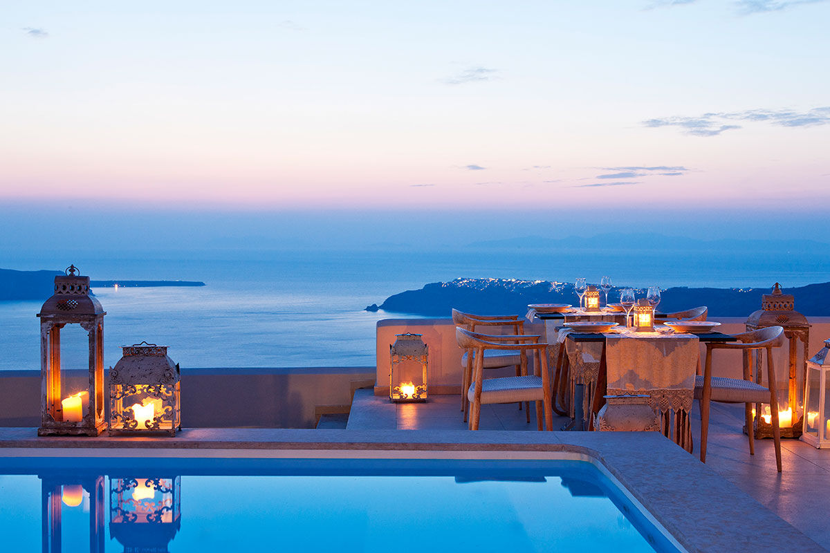 <b>Gold Suites, Imerovigli</b> - Located on the cliffside overlooking the Santorini Caldera, the Gold Suites offer spacious suites with a little glam. The infinity pool, poolside bar and open-air restaurant all face the Aegean Sea — and yet, you certainly will never tire of these views.