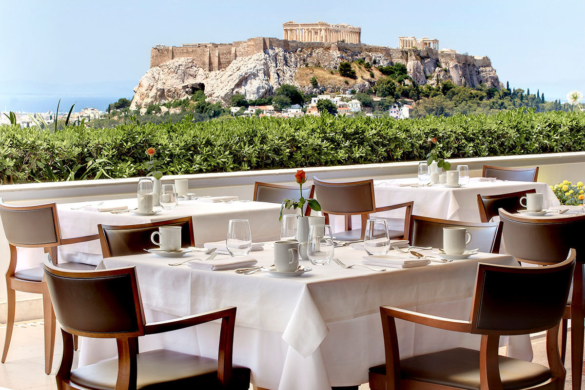 <b>Grande Bretagne</b> - Dating back to 1874, this luxury hotel is situated in the historic center of Athens and is central to all historic monuments. With plush, sophisticated rooms, an elegant rooftop bar, refined cigar lounge, two pools and three restaurants, you couldn’t ask for more!