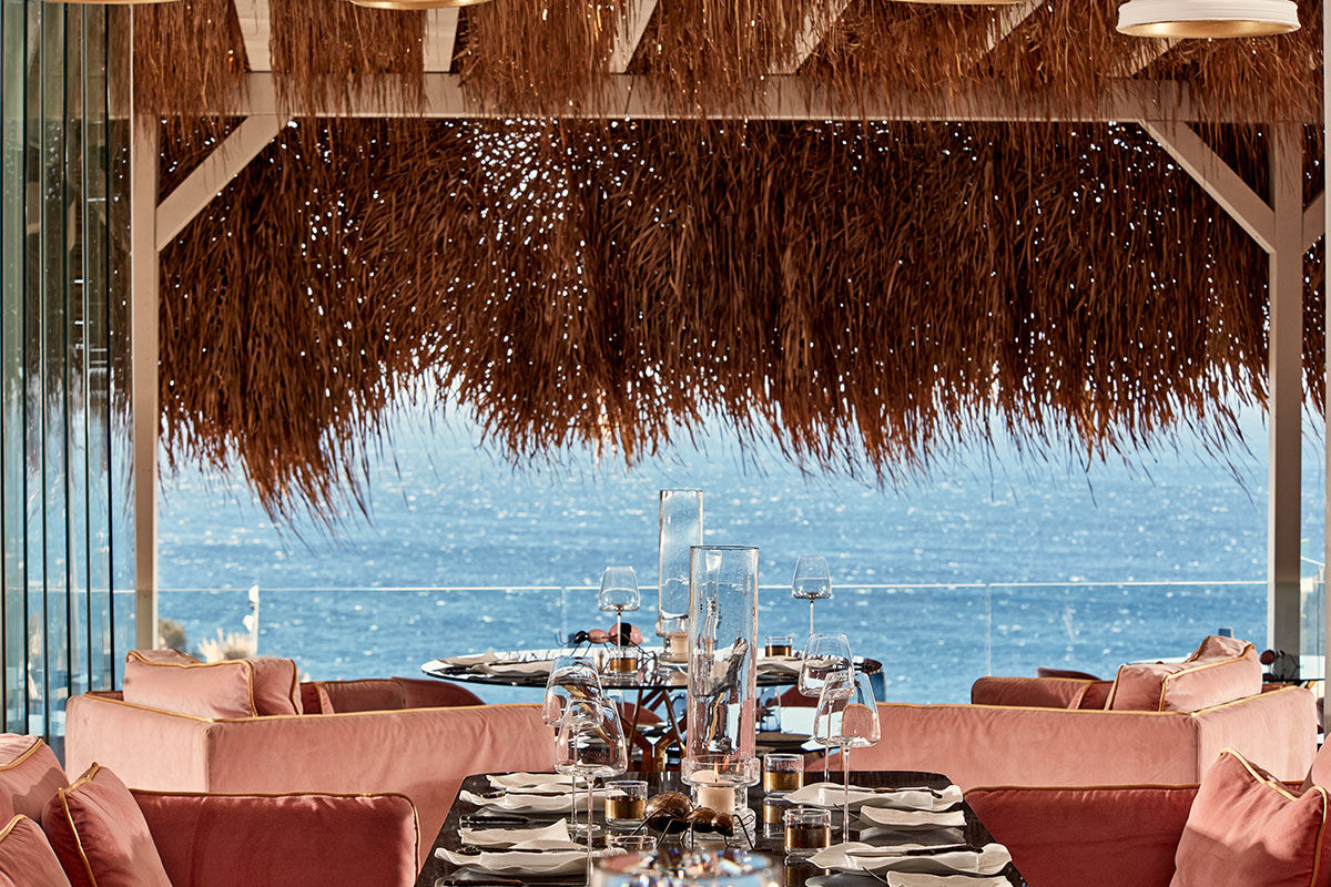 <b>Myconian Villa Collection, Elia</b> - Overlooking Elia Beach from its hillside perch, the Myconian Villa Collection offers luxurious rooms in a minimal Cycladic style with views of the Aegean Sea. Polished and contemporary, this hotel features an infinity pool, poolside bar and a fine dining restaurant right on the sundeck.